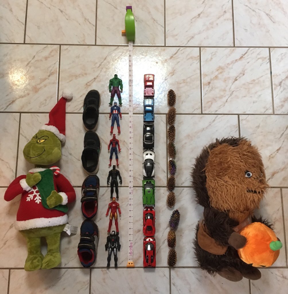 MrWheeldonDFJH's tweet photo. Hey @paf_blueroom, C &amp; C measured how tall their stuffed Chewbacca and Grinch toys are today using other objects around the house. Chewbacca is roughly 21 inches tall, which is equivalent to 7 pine cones or 4.5 cars or 4 super heroes or 3 shoes or 9.5 yogurt cups. https://t.co/kMwH0Kj2AO