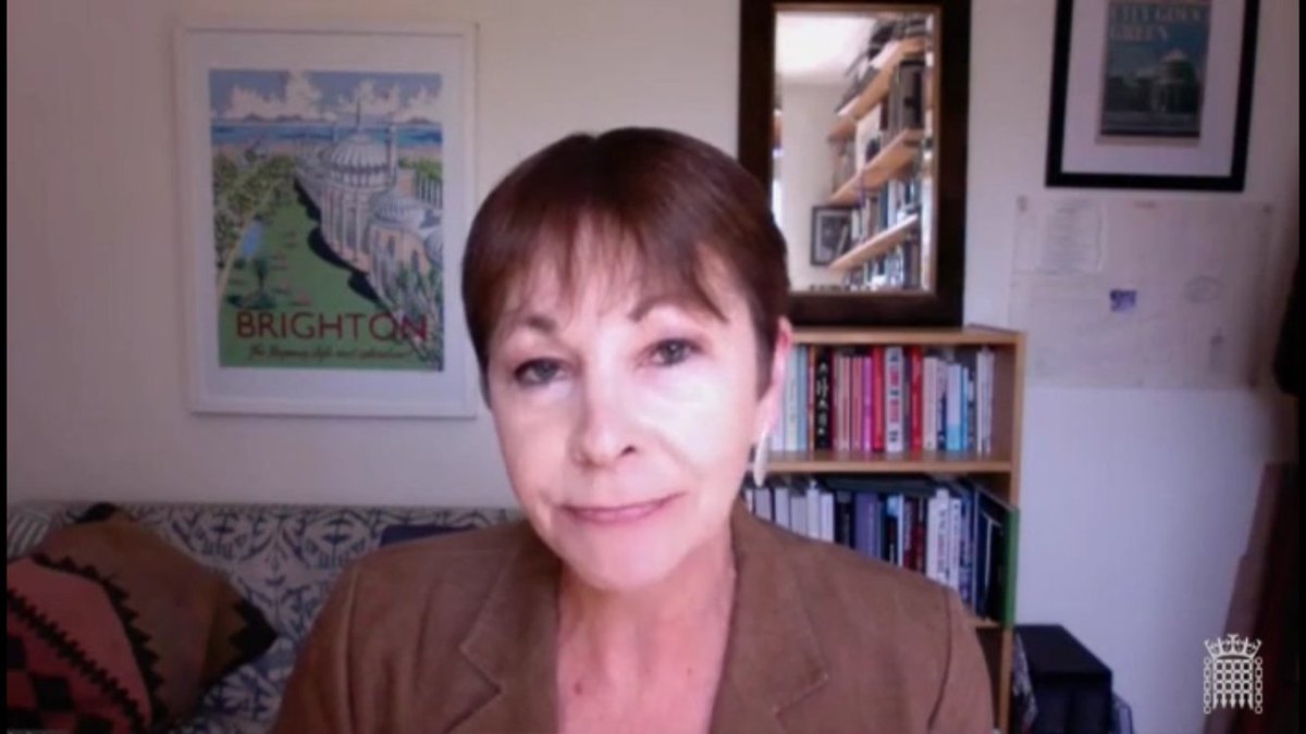 Enormous thanks to <a href="/LucyWhelan/">Lucy Whelan</a> for this one. An orthodox over the shoulder presentation is transformed into a firework display of credibility by the use of a mirror to reveal another bookcase! As Lucy said, wisdom includes reflection. Caroline Lucas at the peak of her powers.