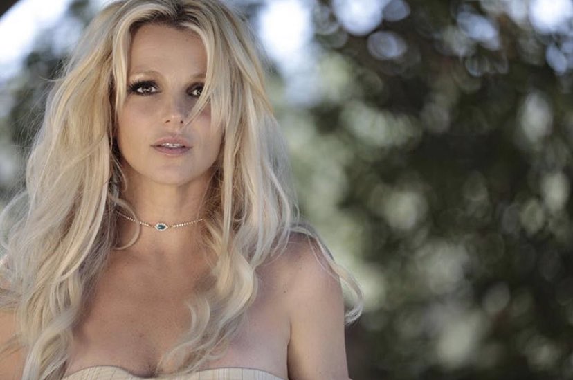 Britney taking photos in her backyard in 2018.