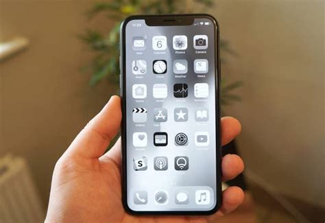 Black+White mode - go to Settings -> Accessibility > Display & Text Size > Color Filters ON - Greyscale.You can set this to a triple tap of the home button for ease, this will remove all the high contrast colours that make your phone so addicting.