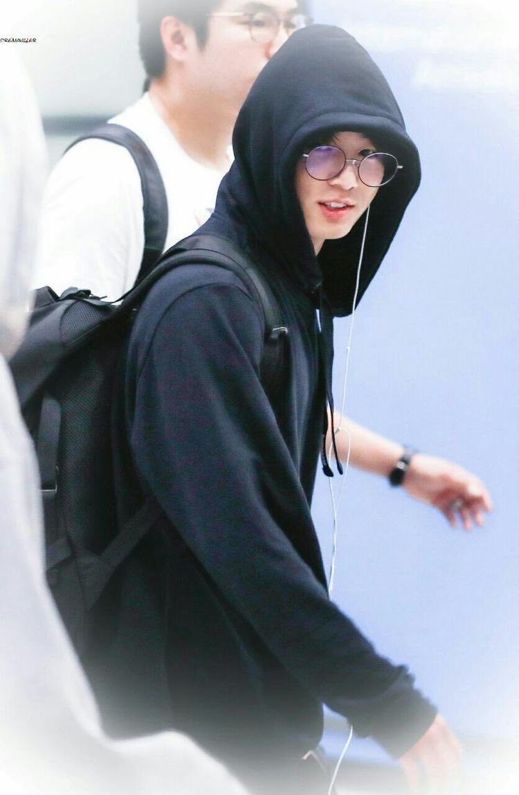 invented wearing glasses and a black hoodie 