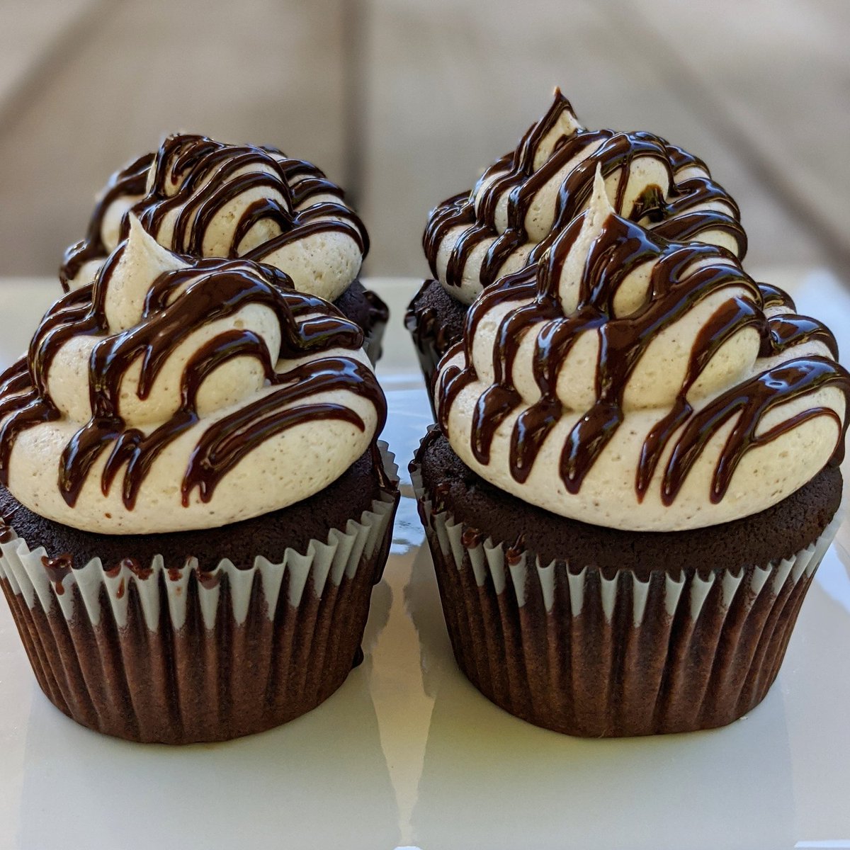 sandratyan's tweet photo. Spicy maya chocolate cupcakes with cinnamon buttercream and chocolate ganache drizzle inspired by my favorite hot chocolate at @CoupaCafe. This recipe has been in the works for a while.. One of the positives of sheltering in place is I'm actually home to bake! #cupcakes #baking https://t.co/xdQ5KFZR0F