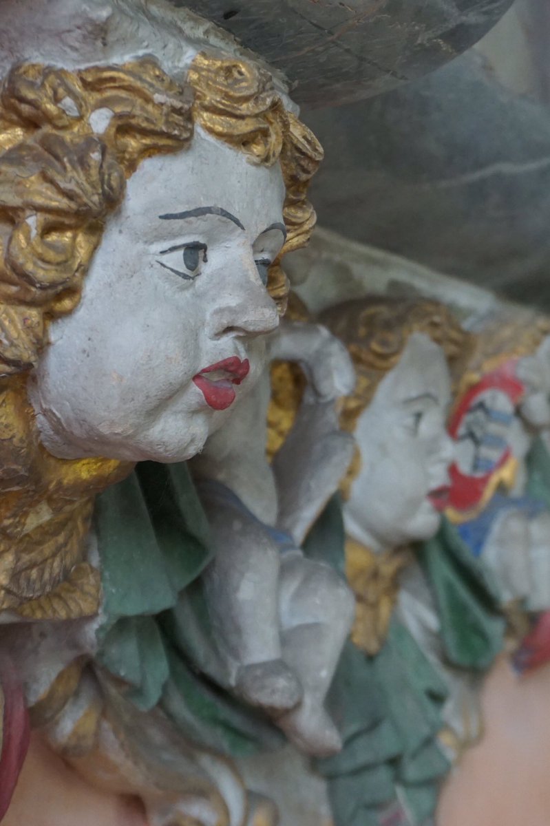 John Ayshford’s marble monument dominates the nave. Ayshford died in 1689, and his memorial is festooned with swags, heraldry, cherubs, scrolls and flaming urns.(6/8)