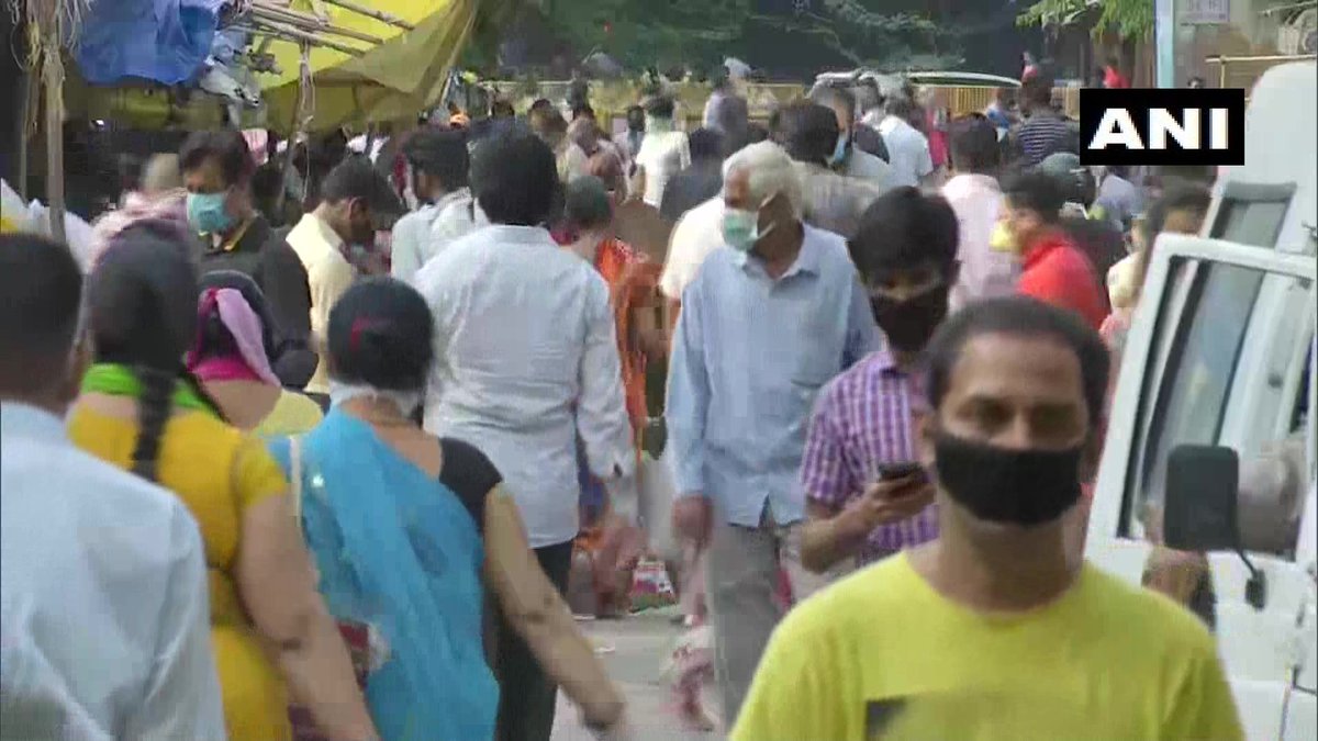 ANI's tweet photo. Delhi: Social distancing norms flouted as crowed seen at a market in Kotla Mubarakpur area. #COVID19 https://t.co/s5V0F5yQvb