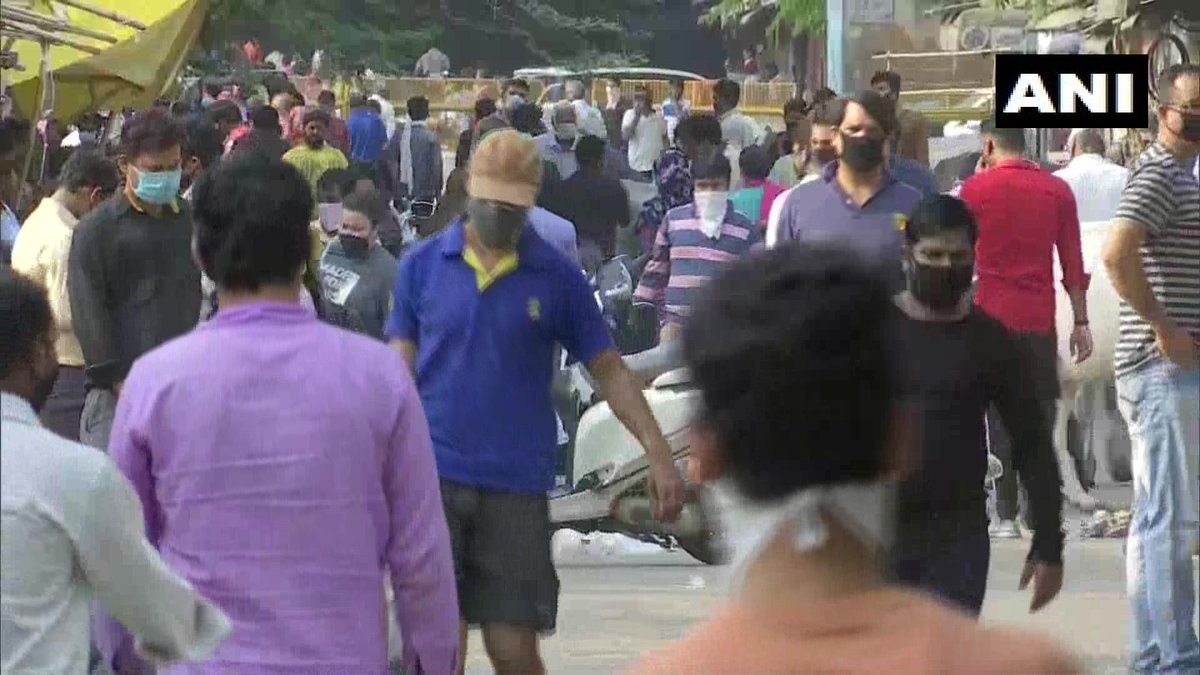 ANI's tweet photo. Delhi: Social distancing norms flouted as crowed seen at a market in Kotla Mubarakpur area. #COVID19 https://t.co/s5V0F5yQvb