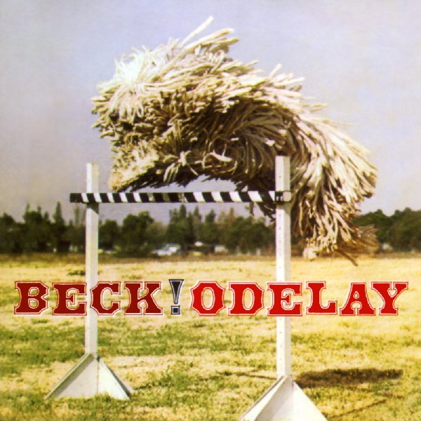 The Art of Album Covers .Beck's 1996 release Odelay used one of several photographs shot by Joan Ludwig for the July 1977 issue of the American Kennel Club’s Gazette..The dog is a Komondor, a breed also referred to as “mop dogs” or “Hungarian sheepdogs”