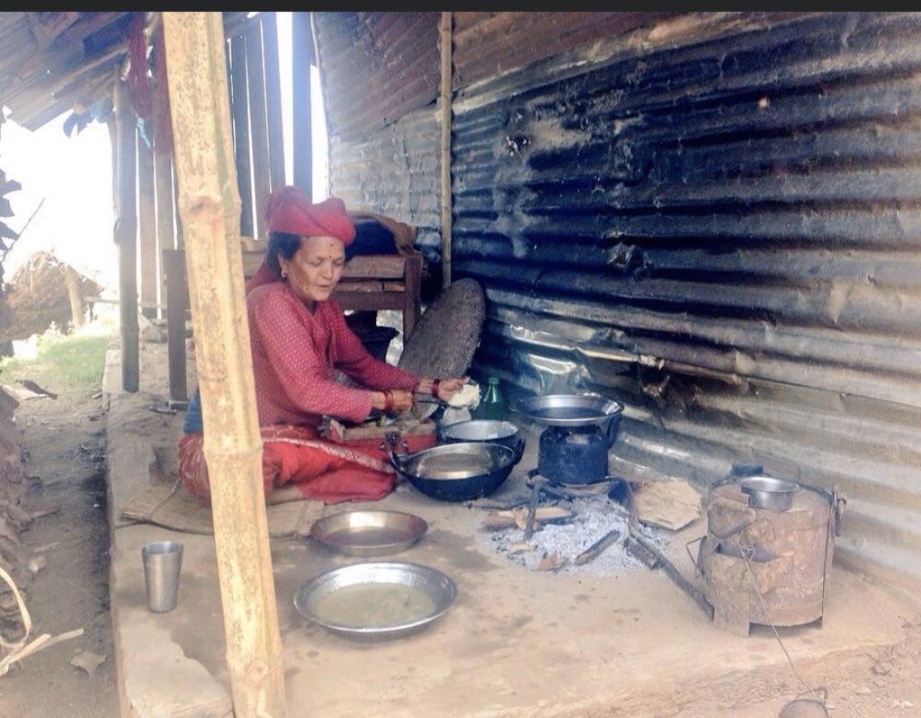 This is Jethi Surkheti, in Arupokhari, Gorkha. Surkheti had lost her house and had her makeshift kitchen outside a tin wall. She wouldn’t let me go insisting, “in our village we don’t let people go without eating”, and took out her special place for guests and served me food