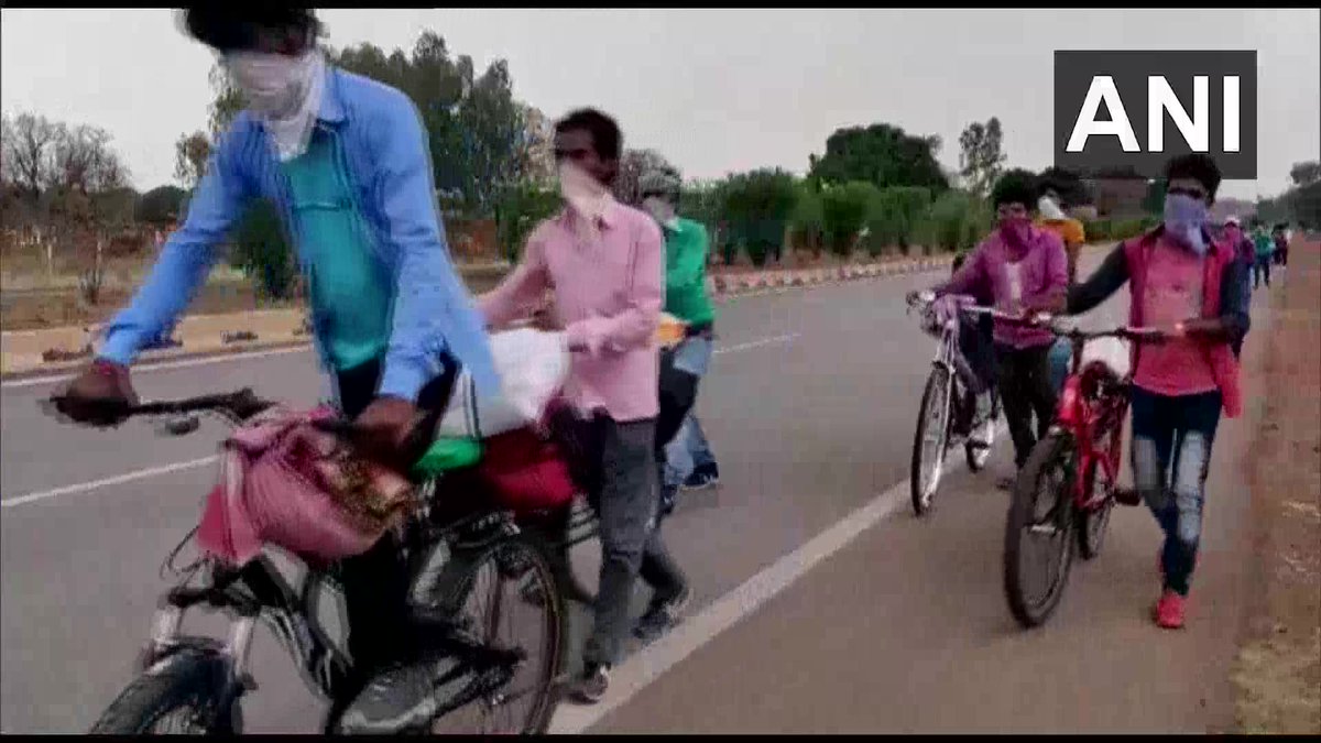 ANI's tweet photo. Madhya Pradesh: A group of 17 migrant workers travelling on bicycles in Rewa towards their homes in Durgapur, West Bengal amid lockdown. "We started our journey yesterday morning from Maihar in Satna &amp; are expecting to reach our homes in next 6-7 days," says a migrant worker. https://t.co/eQIT0xPleC
