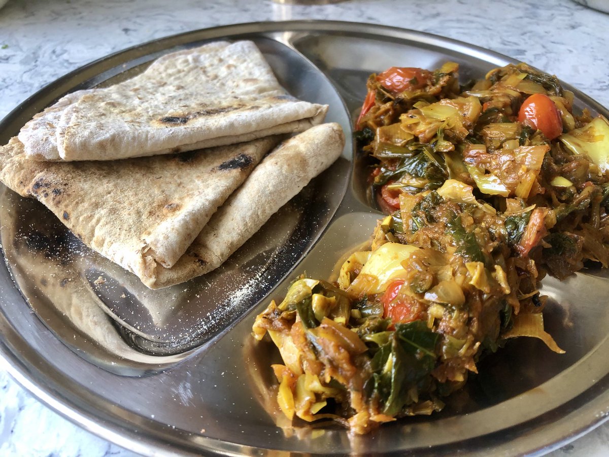 Aneedtopaint's tweet photo. Supper eaten, this curry is an old fave from my childhood and great to use up spring greens, cabbage, leeks and onion, with some cherry tomatoes for good measure and plenty of garlic, also homemade chapatis. #IsolationLife #MySupper Following on from @MsDenisePearson 🥂🍴 https://t.co/C25rSxY91B