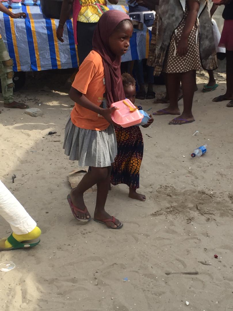 TheDestinyTrust's tweet photo. Raliat drags her sister along as she hurries to the food point. They were late to lunch today but not too late to get a meal. There was enough for all the children because you paid for it. Thank you our friends! #Covid_19 #lockdown #communityfeeding https://t.co/MPtZRC0KBb