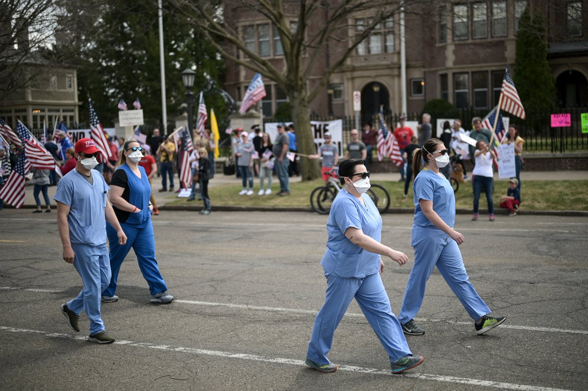 Shortly after the protest started, a group of four counter-protesters arrived, donning medical scrubs. Three of them say they work as emergency nurses at a local ER.