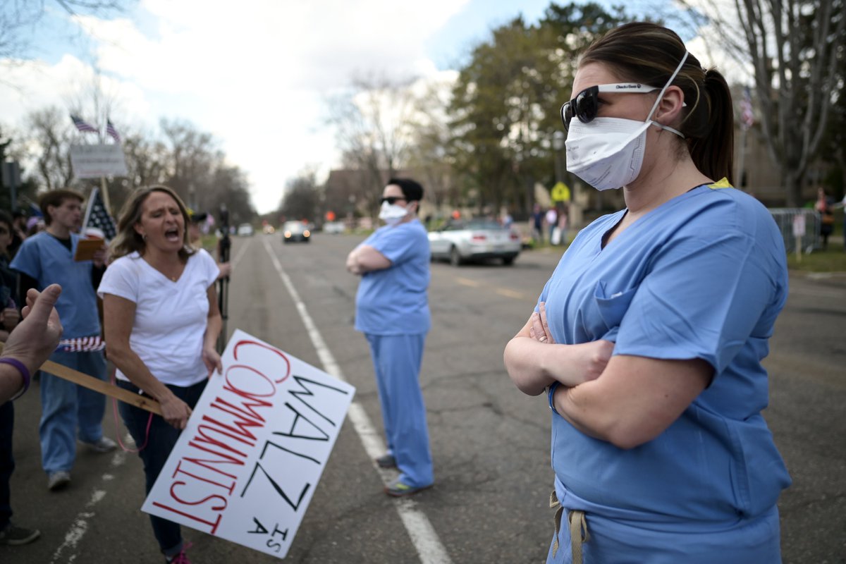 They were met with cheers and jeers, with some protestors thanking them for their work and others claiming they were crisis actors looking for a viral moment.