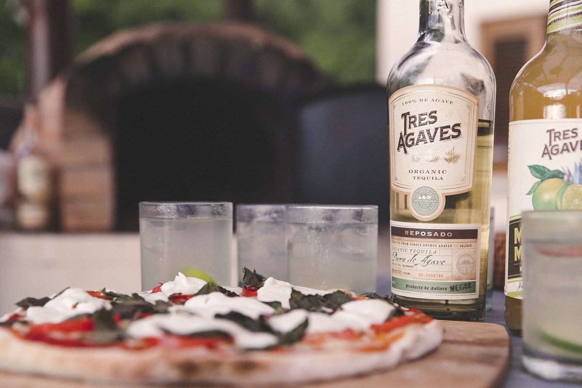 You see Margherita, we say margarita - heck why not do them both? The saltiness from the cheese and crust of the pizza blend perfectly with the lime of our margarita mix to create a delicious (and easy) meal - quarantined or otherwise!  #TresAgaves #Margarita #Pizza