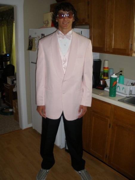 WichitAustin's tweet photo. My pink suit was in the cleaners tonight, but here’s a pic of me from the last prom I attended. #wevirtualpromtogether #BlueAceNation https://t.co/oKnoIgvhpN