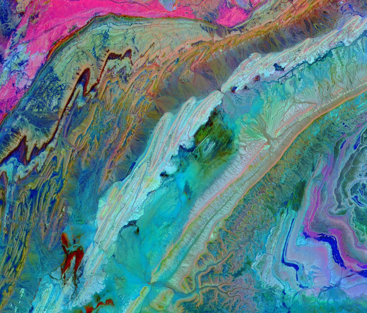WIRED's tweet photo. Wow. Earth's topography comes to resemble that of an alien world when viewed under different wavelengths. https://t.co/DFF1ovwP9q https://t.co/FvILPPNvon