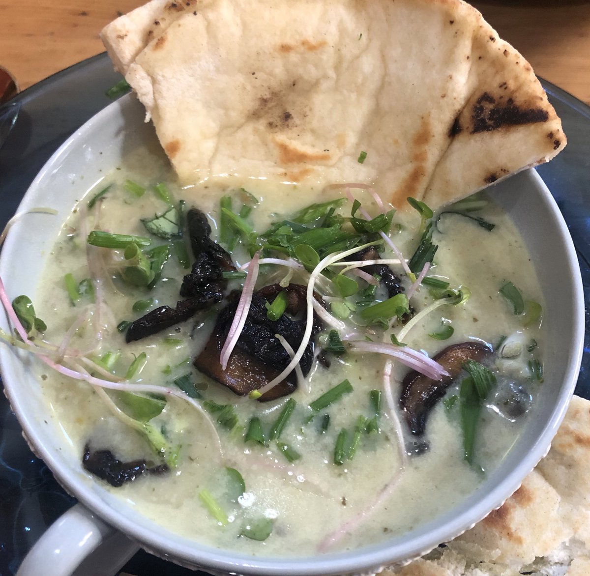 Tonight's potato - bok choy and potato soup w mushrooms, radish sprouts, chives and fried pita