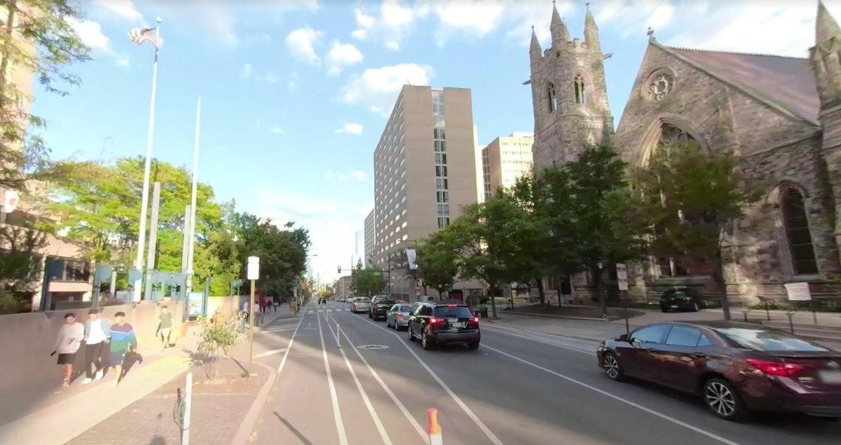 Philadelphia offers "the best examples in this country" of slowly widening streets through setback requirements and attrition, most famously at Chestnut  https://en.wikipedia.org/wiki/Chestnut_Street_(Philadelphia) and also Frankford Avenue