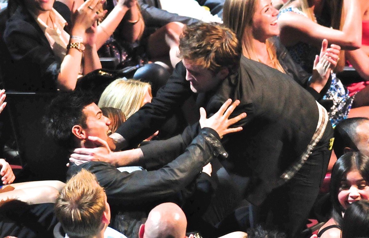 Kissing Taylor lautner when he and Kristen Stewart won best kiss at mtv awards