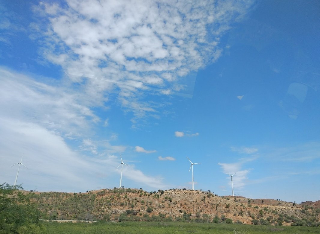 Windmills on a road trip during a very hot summer in Andhra Pradesh