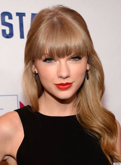 Taylor Swift's most iconic red lipstick looks A thread: