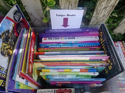 TheBookWhisper2's tweet photo. The Little Lockdown Library is doing a brisk trade today, and we've added a bin with freshly washed 'Reading Buddies' now too to encourage the wee ones to read out loud ๐ https://t.co/NMH5WP2OmN