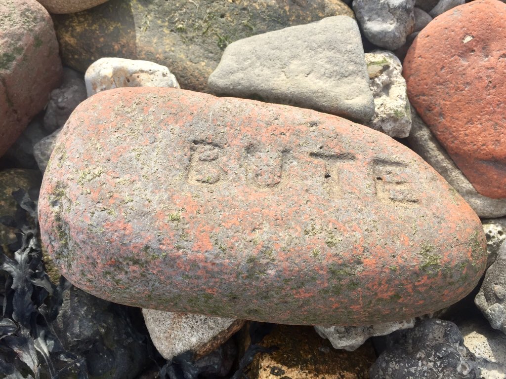 The beach is full of half-buried old bricks, stamped with the names of long-gone Welsh industrial ghosts.They spark thoughts of the life that used to team around the factories, docks, pubs & terraces which are now bland industrial units.
