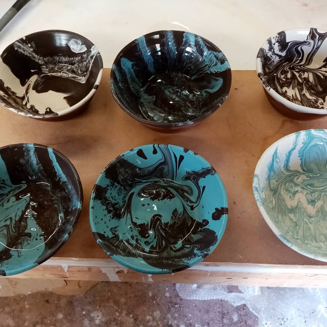 Freshly slipped bowls. Teying out different thicknesses of slip to see how they react to each other and colour combination