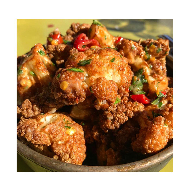 Our crispy cauliflower is the perfect starter. Served with calabrian chili, lemon, and bagna cauda sauce on the side... 📷: @myfoodscapades