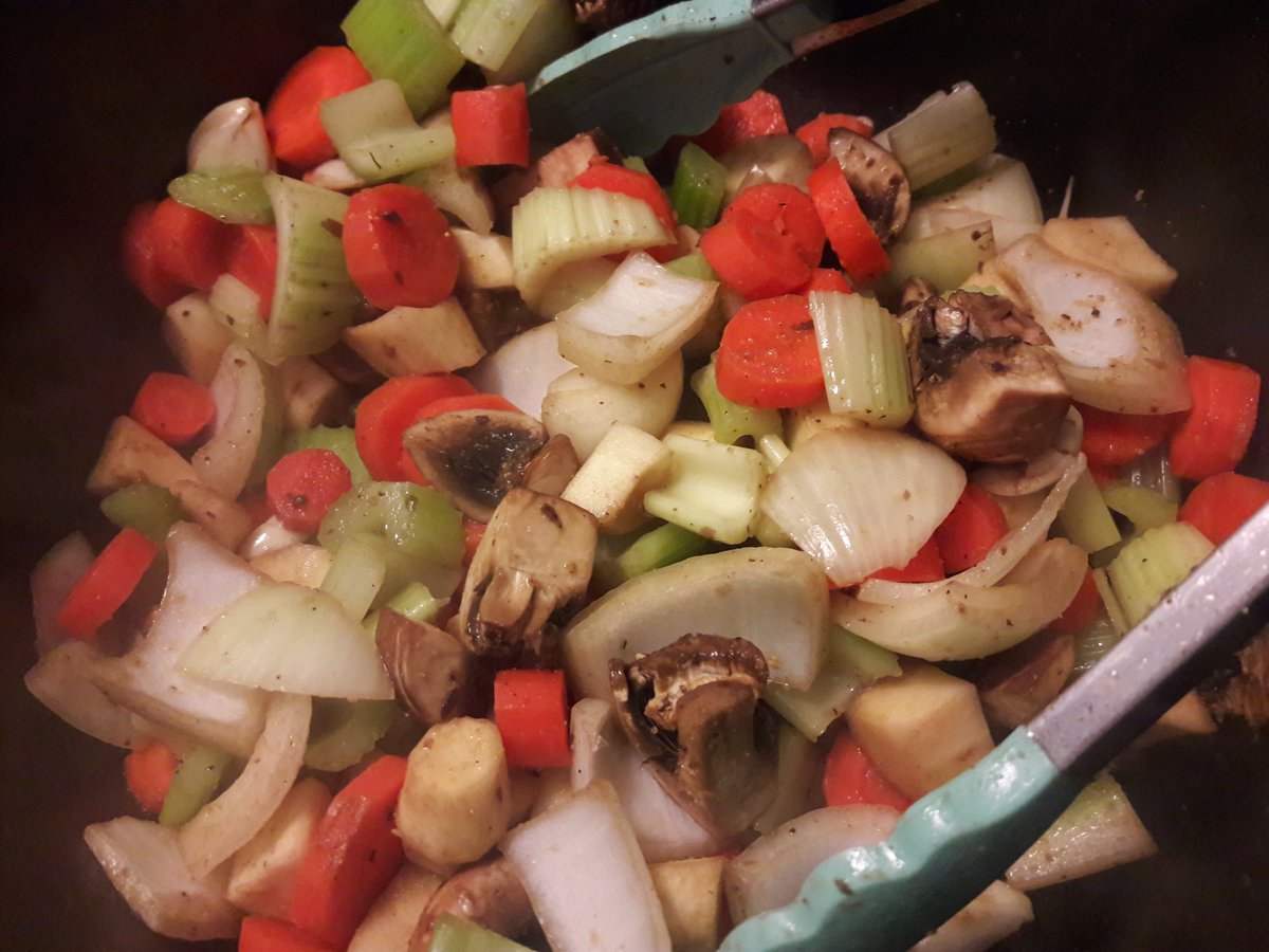 Browning the veggies, added some extra seasoning (tomato paste, Worcestershire sauce, whole peppercorns), added the chunks of browned beef back to the pot with red wine and beef stock, then topped with some butter, bay leaves and fresh rosemary and thyme. Ready for the oven!