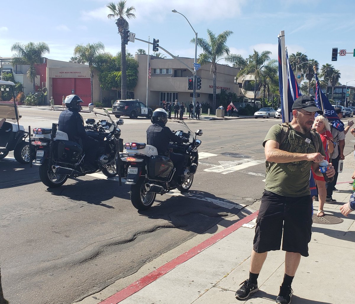 Officers asked the remaining protesters to disperse more directly, but some holdouts are undeterred. The officers, uninterested in an escalation, leave the corner containing the remaining protesters to patrol and observe from across the street.