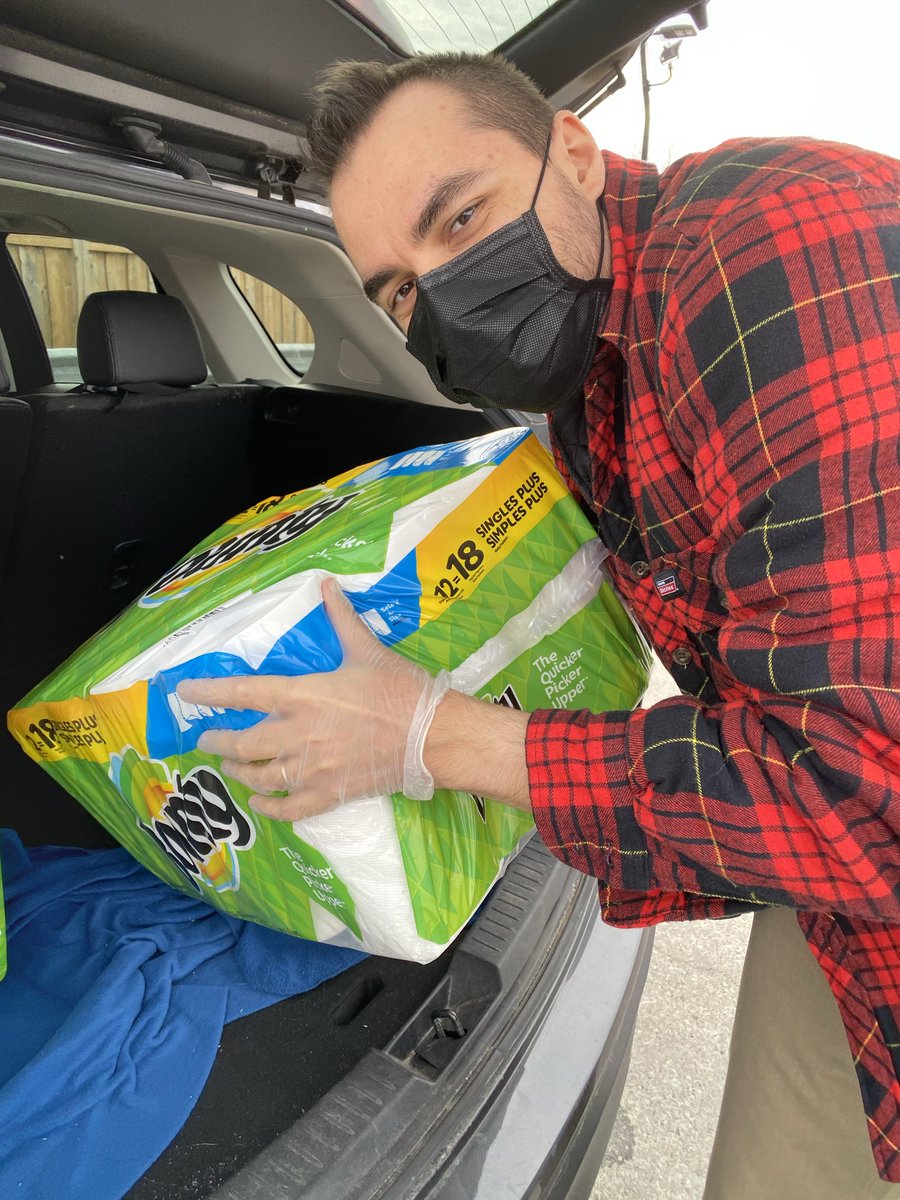 Putting on the shopping safety gear for our weekly groceries run.Outdoor-only pants and jacket that are left to quarantine for a week in the garage, gloves, and mask.