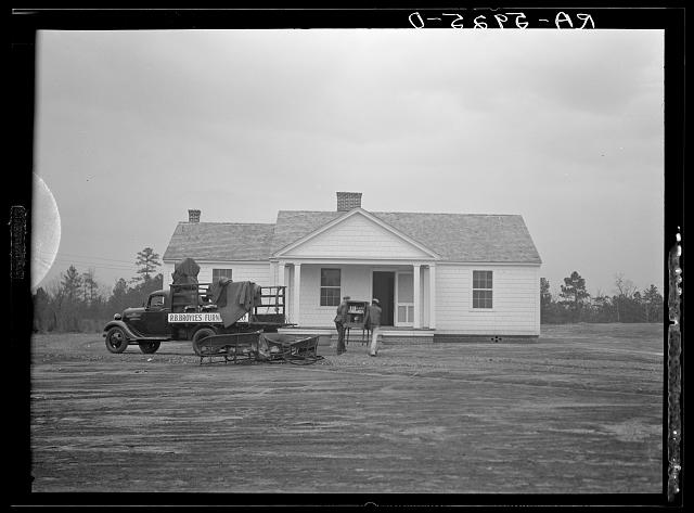 Another common complaint was the rammed earth houses were ugly. Many people passed on them, despite the worldwide fame the project received (even Nehru came for a visit). So some houses were made to look more traditional within the same time frame and budget. Moving in day!