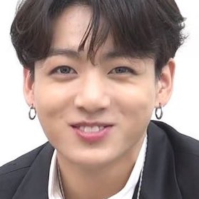 Jungkook exposing his bunny teeth while smiling — a thread