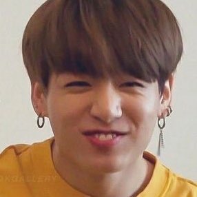 Jungkook exposing his bunny teeth while smiling — a thread