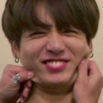 Jungkook exposing his bunny teeth while smiling — a thread