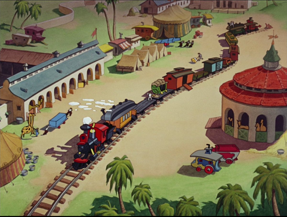 Two big examples. First is how they incorporate Casey Jr, the train, into the opener. For one thing, it begins wit a most traditional establishing wide. An untethered Walt would have flown his camera past or through every animal cage before landing at the head of this line-up...