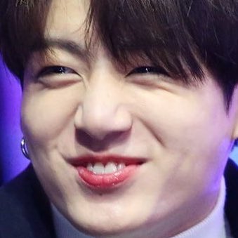 Jungkook exposing his bunny teeth while smiling — a thread