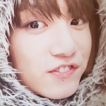 Jungkook exposing his bunny teeth while smiling — a thread