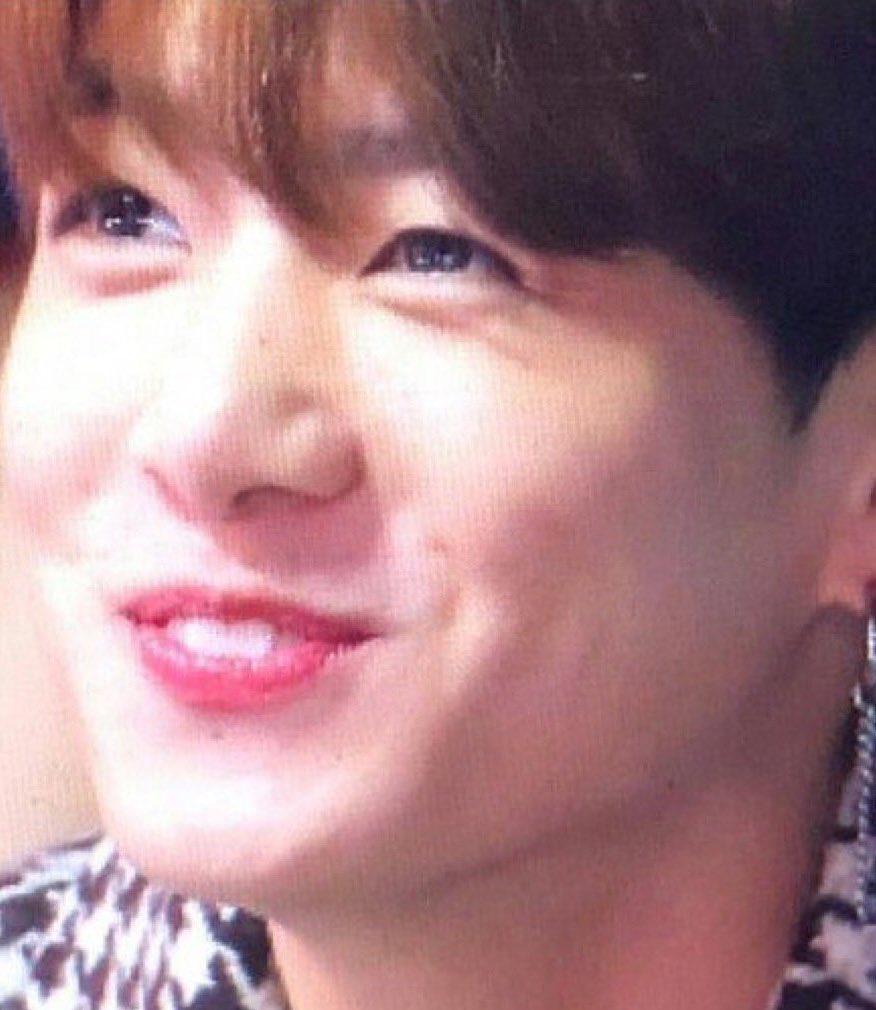 Jungkook exposing his bunny teeth while smiling — a thread