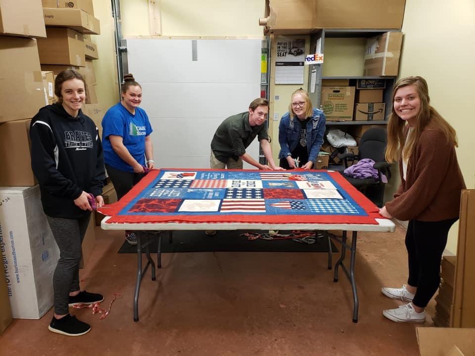 Mandan Lions Serve collecting and cleaning eye glasses while the Mandan Leo’s make the blankets for those taking dialysis 🦁. ## We Serve