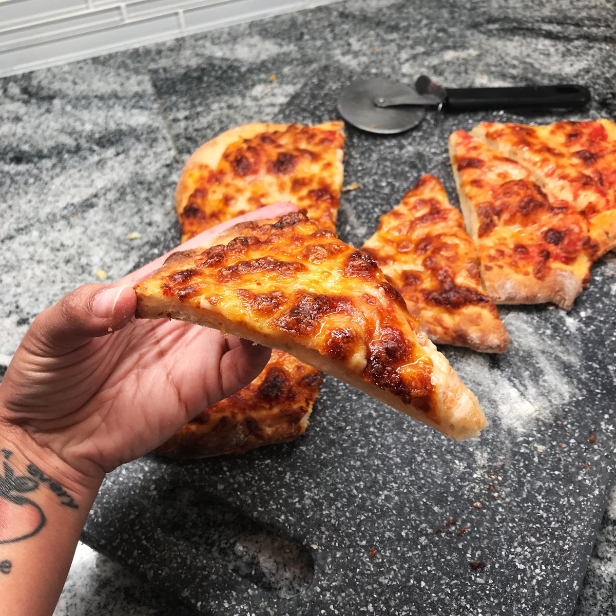 Bread #36: Thin-Crust Pizza. This was lovely! It had a long slow rise in the fridge so the crust was really flavorful. My only complaint is that they should have emphasized A LOT of flour on the pizza peel (or cornmeal or parchment paper) because I had some really bad sticking.