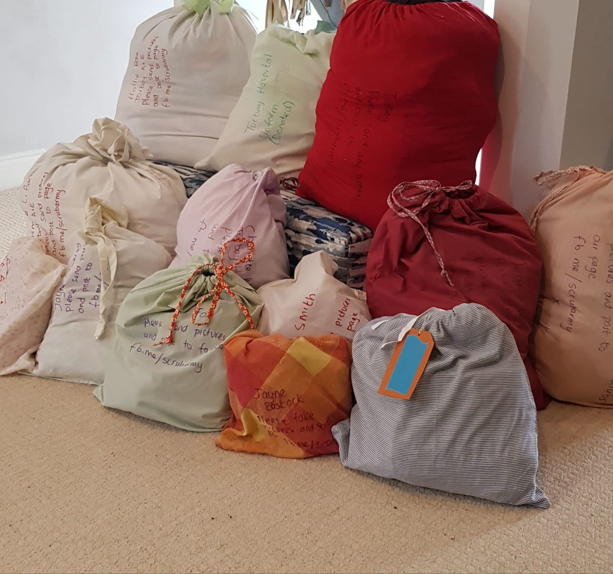 Swapping curtains to help make Scrubs for our NHS and carers. We have now made 242 sets!