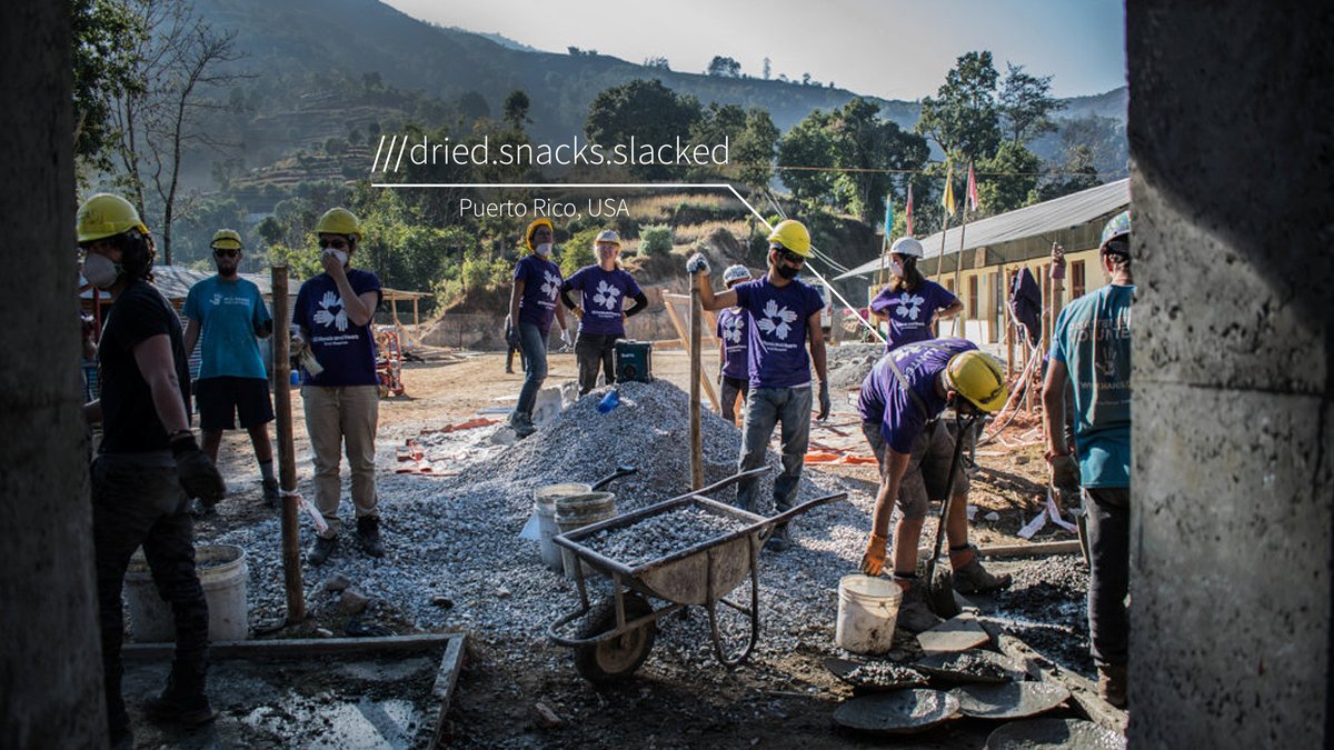 humanitarian workers work at the site of a disaster. what3words address reads: dried.snacks.slacked. 