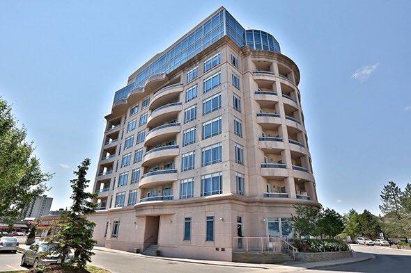 This condo in Vaughan is a terrible building. It looks like what would happen if a suburban office building and a Hilton Garden Inn had a baby.