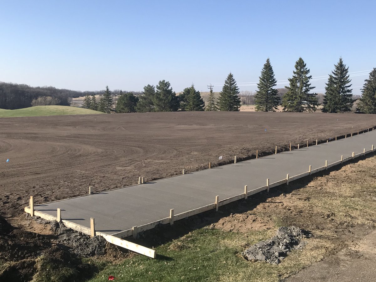 New driving range all-season tee line and 26,000 square foot laser-leveled turf tee at Island View Golf Club.  Seed this week @MnGCSA @ASGCA #golfdesign #golfrenovation