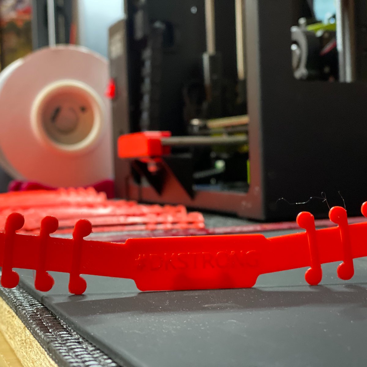 Kwalseth's tweet photo. I've had these two #3Dprinters going all weekend creating #earsavers for the #frontlineworkers @digikey. @Lulzbot and @Makeblock printers don't disappoint. #DKSTRONG https://t.co/xpfWg8nL5u