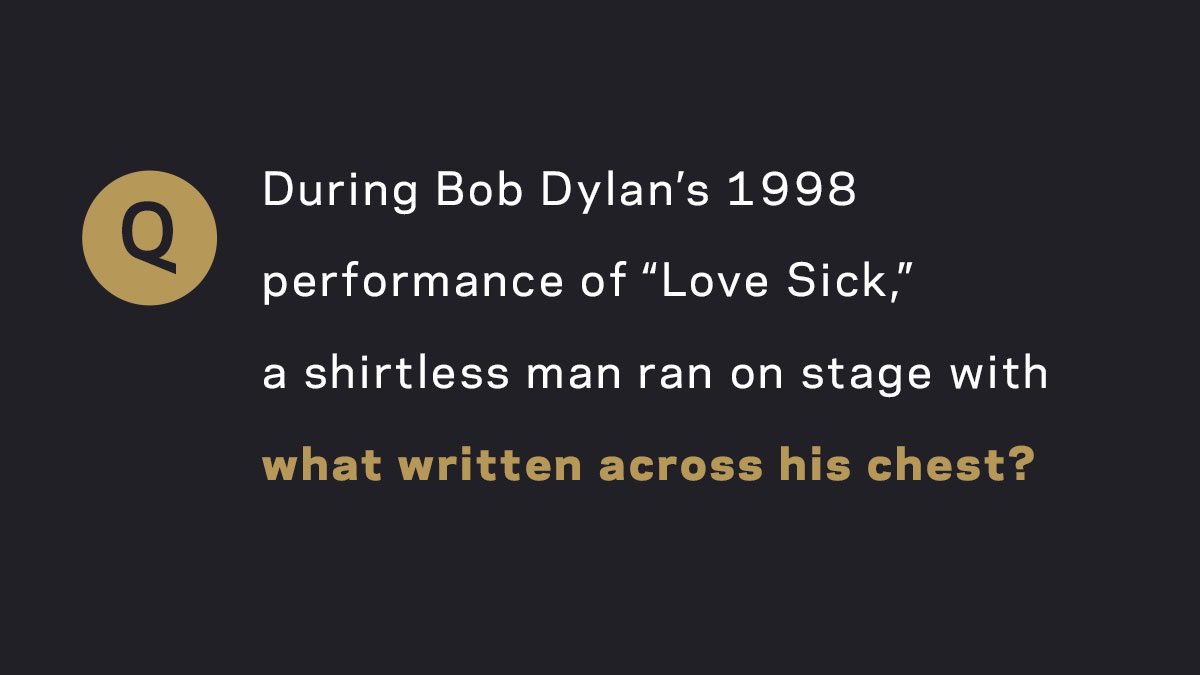 RecordingAcad's tweet photo. What was written across the chest of the shirtless man who ran on stage during #BobDylan’s performance? #GRAMMYTrivia https://t.co/n9dQbGSYYd