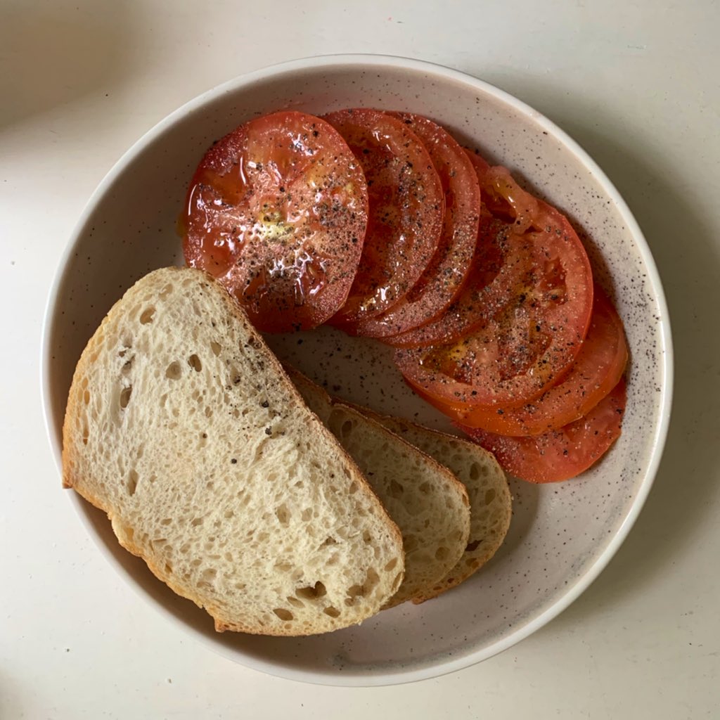 this barely constitutes a meal but it is one of my fav things to eat. truly there are fewer greater pleasures than tomato and pepper on fresh bread