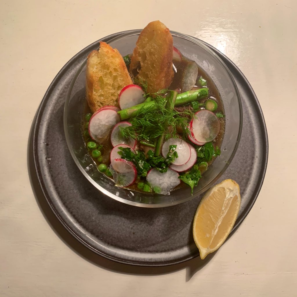 this is a spring veggie stew w pistou and bread and horseradish