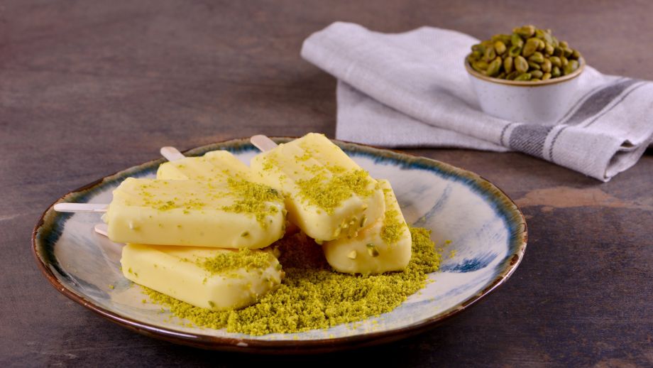 KulfiThe word "Kulfi" comes from Persian "Qufli" which means "covered cup". This Mughal dessert originated in India by mixing two Central Asian ingredients: saffron and pistachio.